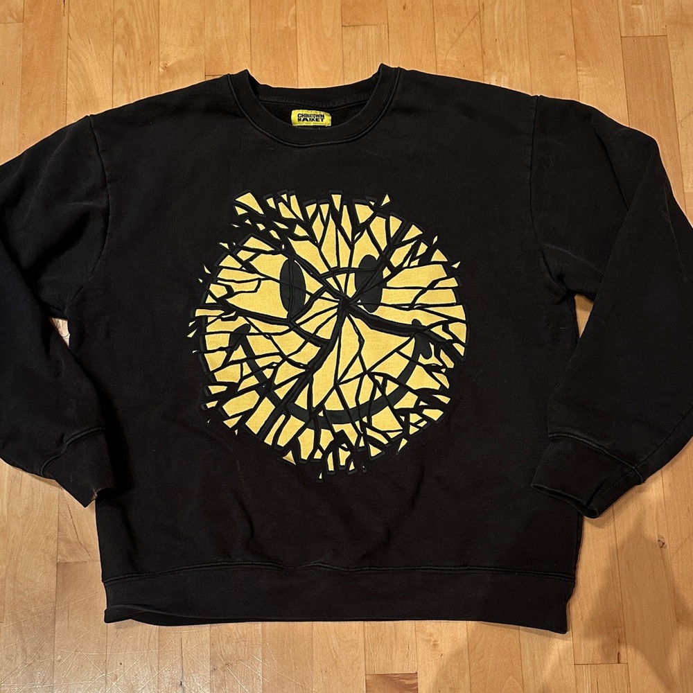 Chinatown Market Black Crewneck Sweatshirt with Yellow Graphic Smiley